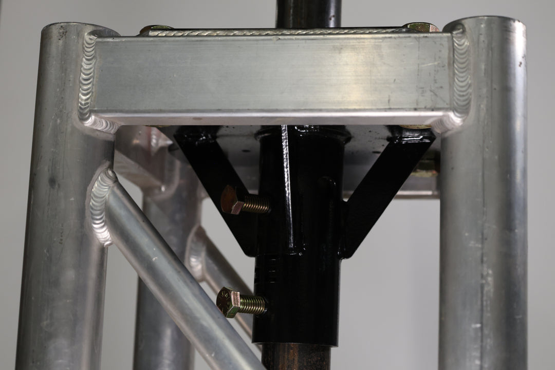Bracket designed for mounting pipe to truss, base plates, or screwed directly to the stage. shown here mounted to the inside of a piece of truss