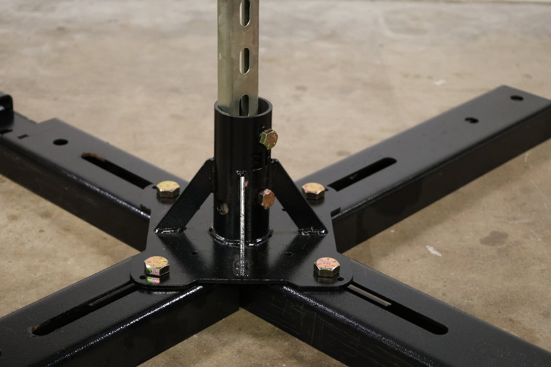 Bracket designed to build a lighting boom by mounting pipe to truss, base plates, or screwed directly to the stage, shown here holding a piece of strut