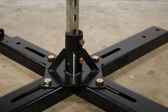 Bracket designed to build a lighting boom by mounting pipe to truss, base plates, or screwed directly to the stage, shown here holding a piece of strut