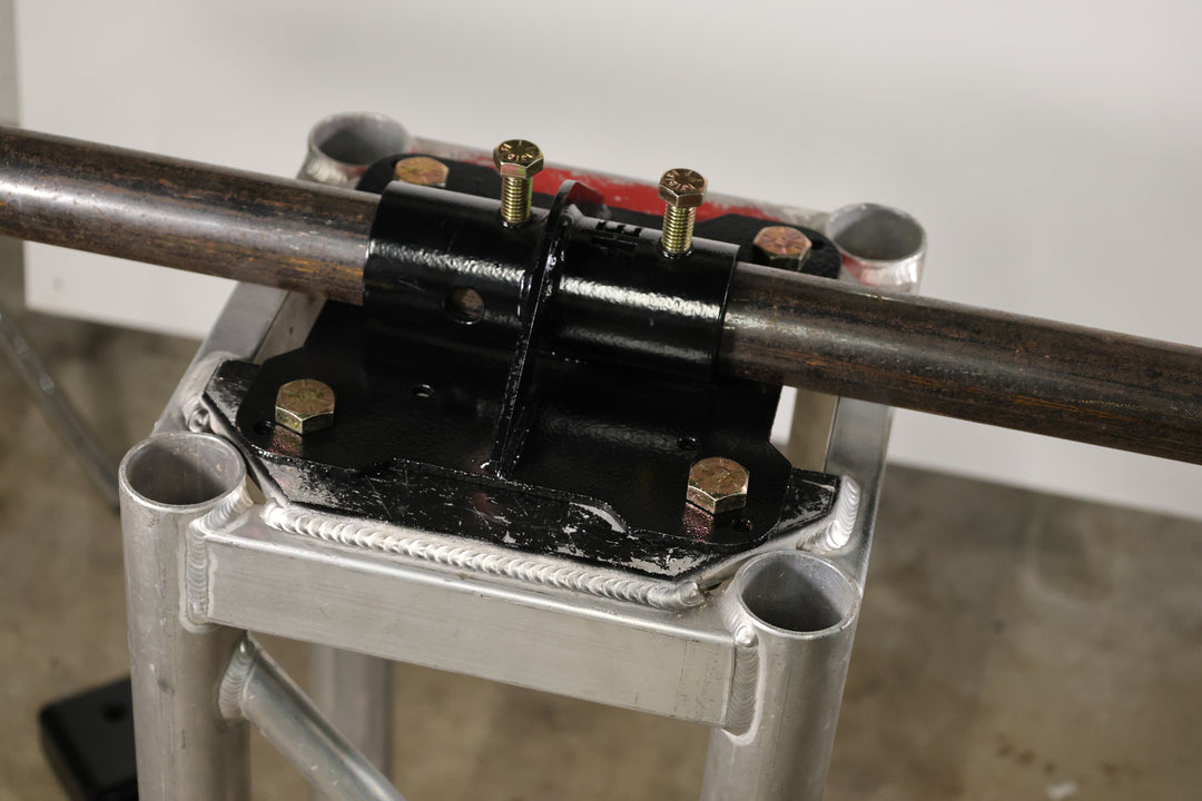 Bracket designed for mounting pipe horizontally to the top of truss.