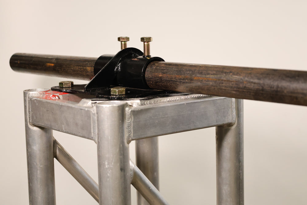 Bracket designed for mounting pipe horizontally to the top of truss.