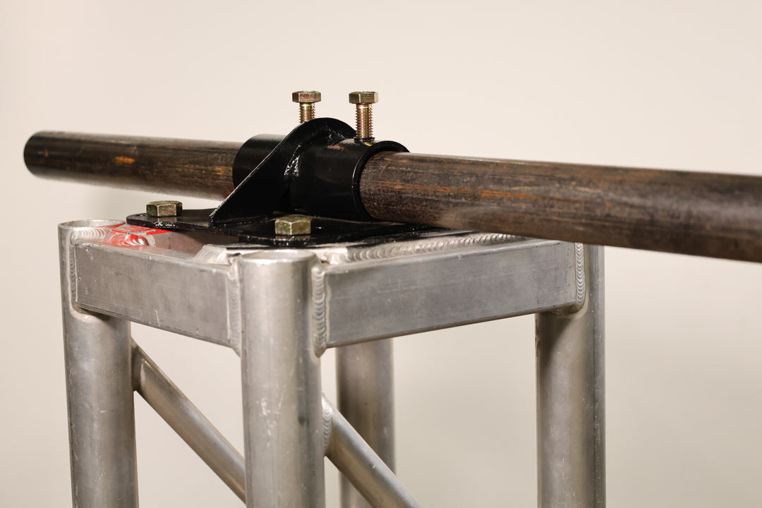 Bracket designed for mounting pipe horizontally to the top of truss.
