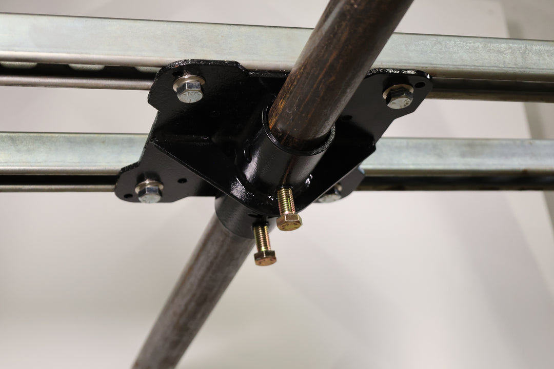Bracket designed for mounting pipe horizontally to the top of truss. shown here mounted to unistrut in a ceiling