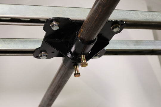 Bracket designed for mounting pipe horizontally to the top of truss. shown here mounted to unistrut in a ceiling